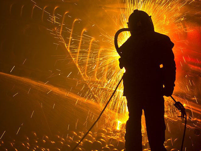 Kaltech worker in mill amid sparks